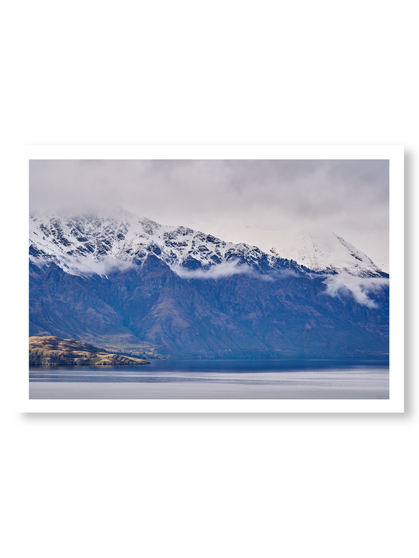 Cloud Drift fine art landscape print featuring snow-covered New Zealand mountains and foggy alpine terrain. Moody Queenstown photography wall art, perfect for winter interiors. Premium giclée print on archival paper. Ideal for modern home décor, minimalist design, and Scandinavian-style spaces. Available from Melbourne Print Studio, part of the Snowdrift Collection.