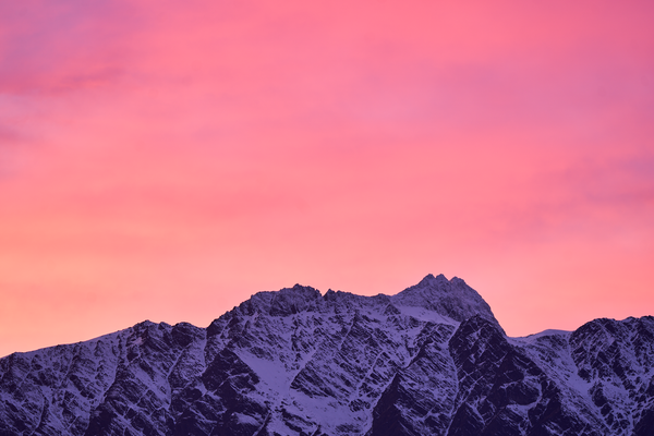 First Light fine art landscape print featuring snow-covered New Zealand mountains and foggy alpine terrain. Moody Queenstown photography wall art, perfect for winter interiors. Premium giclée print on archival paper. Ideal for modern home décor, minimalist design, and Scandinavian-style spaces. Available from Melbourne Print Studio, part of the Snowdrift Collection.