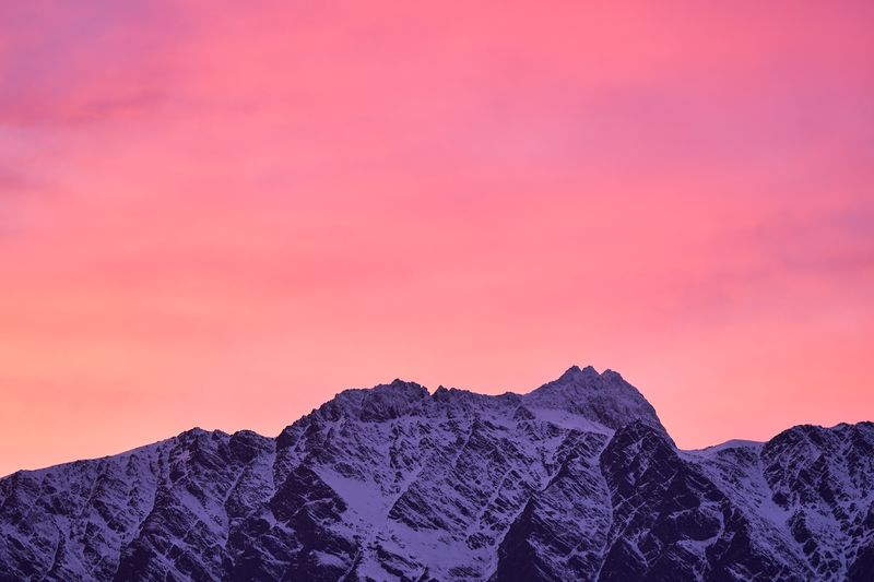 First Light fine art landscape print featuring snow-covered New Zealand mountains and foggy alpine terrain. Moody Queenstown photography wall art, perfect for winter interiors. Premium giclée print on archival paper. Ideal for modern home décor, minimalist design, and Scandinavian-style spaces. Available from Melbourne Print Studio, part of the Snowdrift Collection.