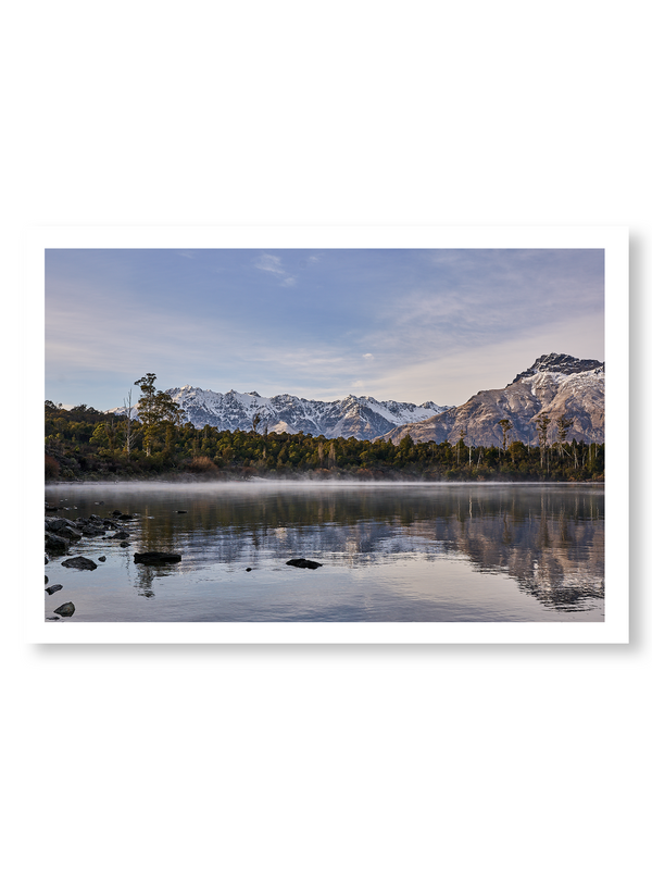 Lake Haze fine art landscape print featuring snow-covered New Zealand mountains and foggy alpine terrain. Moody Queenstown photography wall art, perfect for winter interiors. Premium giclée print on archival paper. Ideal for modern home décor, minimalist design, and Scandinavian-style spaces. Available from Melbourne Print Studio, part of the Snowdrift Collection.