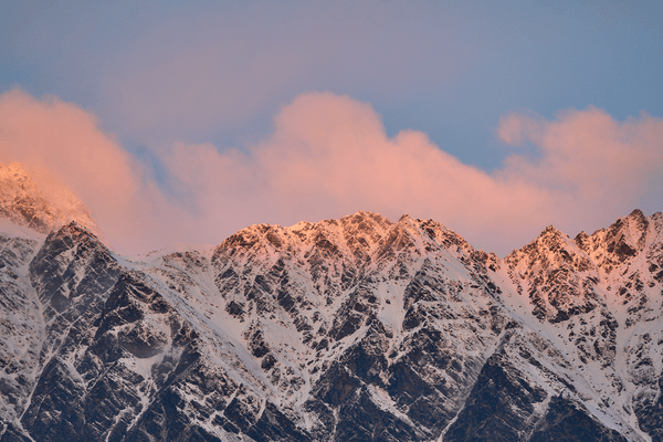 Cloud Ridge fine art landscape print featuring snow-covered New Zealand mountains and foggy alpine terrain. Moody Queenstown photography wall art, perfect for winter interiors. Premium giclée print on archival paper. Ideal for modern home décor, minimalist design, and Scandinavian-style spaces. Available from Melbourne Print Studio, part of the Snowdrift Collection.