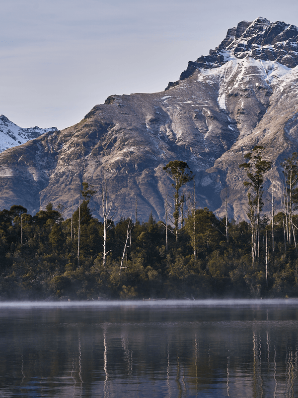 Deep Blue, fine art landscape print, New Zealand mountain photography, snow-capped mountain wall art, moody alpine photo print, designer winter landscape wall art, fog and snow mountain print, Queenstown mountain art print, luxury home décor, fine art photography for interiors, minimalist wall print, contemporary nature photography, premium giclée print, Melbourne Print Studio, Australian Wall Prints, Scandinavian interior art, mountain range photography print, modern landscape wall décor