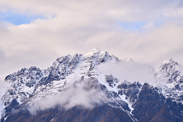 Frost Snap fine art landscape print featuring snow-covered New Zealand mountains and foggy alpine terrain. Moody Queenstown photography wall art, perfect for winter interiors. Premium giclée print on archival paper. Ideal for modern home décor, minimalist design, and Scandinavian-style spaces. Available from Melbourne Print Studio, part of the Snowdrift Collection.