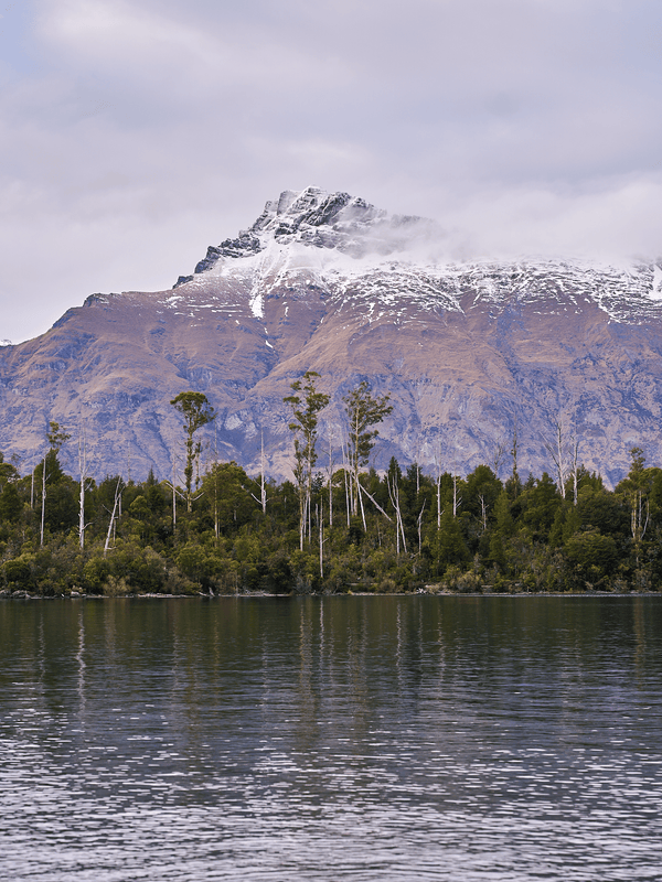 Still Water, fine art landscape print, New Zealand mountain photography, snow-capped mountain wall art, moody alpine photo print, designer winter landscape wall art, fog and snow mountain print, Queenstown mountain art print, luxury home décor, fine art photography for interiors, minimalist wall print, contemporary nature photography, premium giclée print, Melbourne Print Studio, Australian Wall Prints, Scandinavian interior art, mountain range photography print, modern landscape wall décor