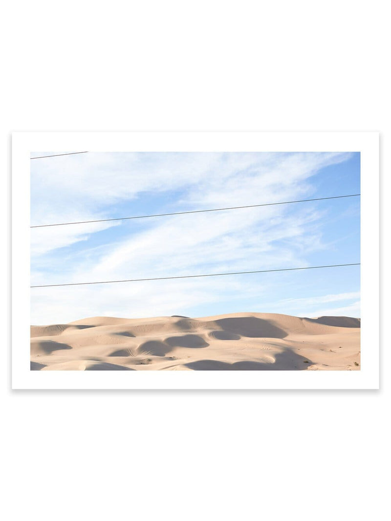Landscape photography print of the Arizona Desert with blue sky, golden sand dunes that appear to go on for days. Perfect for people who like Joshua Tree, Palm Springs, Los Angeles, Beach and Coastal Print Artworks and Wall Décor/ Decor. This print option a white border (measuring between 5cm and 4cm depending on print size selected) so the print will have a white border framing the print when it is framed.